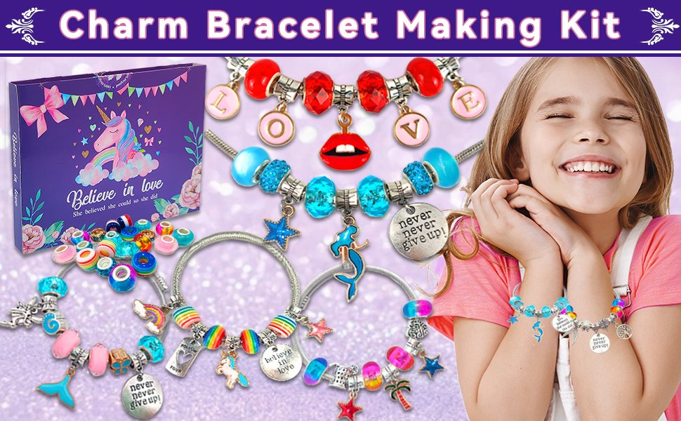 Girl smiling with a charm bracelet making kit, featuring unicorn, mermaid, and rainbow charms, beads, and bracelets.