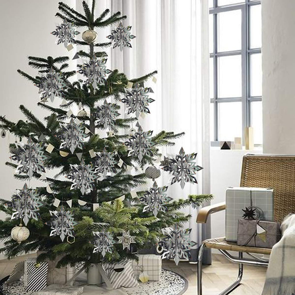 Christmas tree decorated with 3D hanging snowflake ornaments in white and silver.