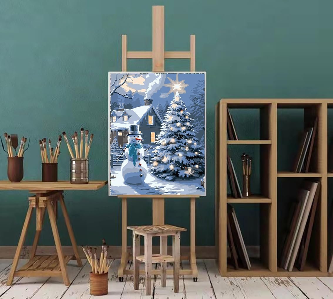 Christmas paint by number kit showing a snowman and decorated tree in front of a house