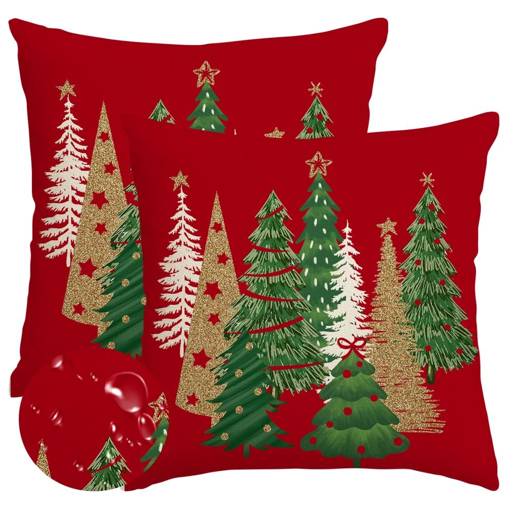 Two red Christmas pillow covers with various decorated trees, including glittery gold trees and green trees with red ribbon accents.