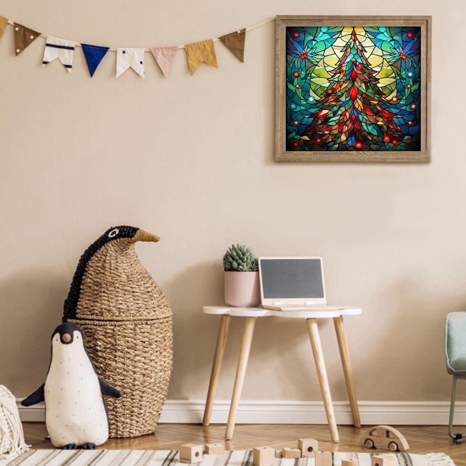 Framed stained glass Christmas tree artwork hanging on a wall above a small table with decorative items.