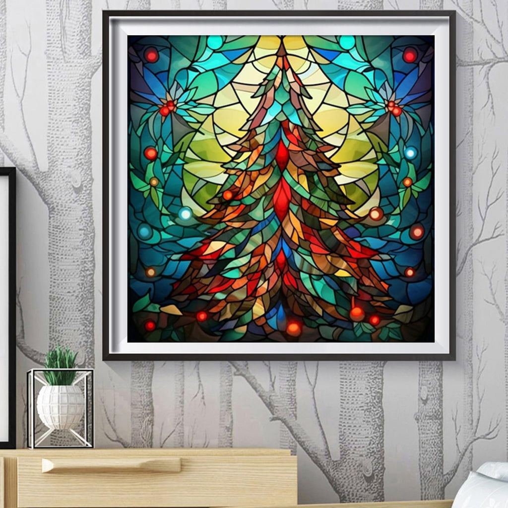 Framed stained glass style Christmas tree diamond painting kit displayed on a wall.