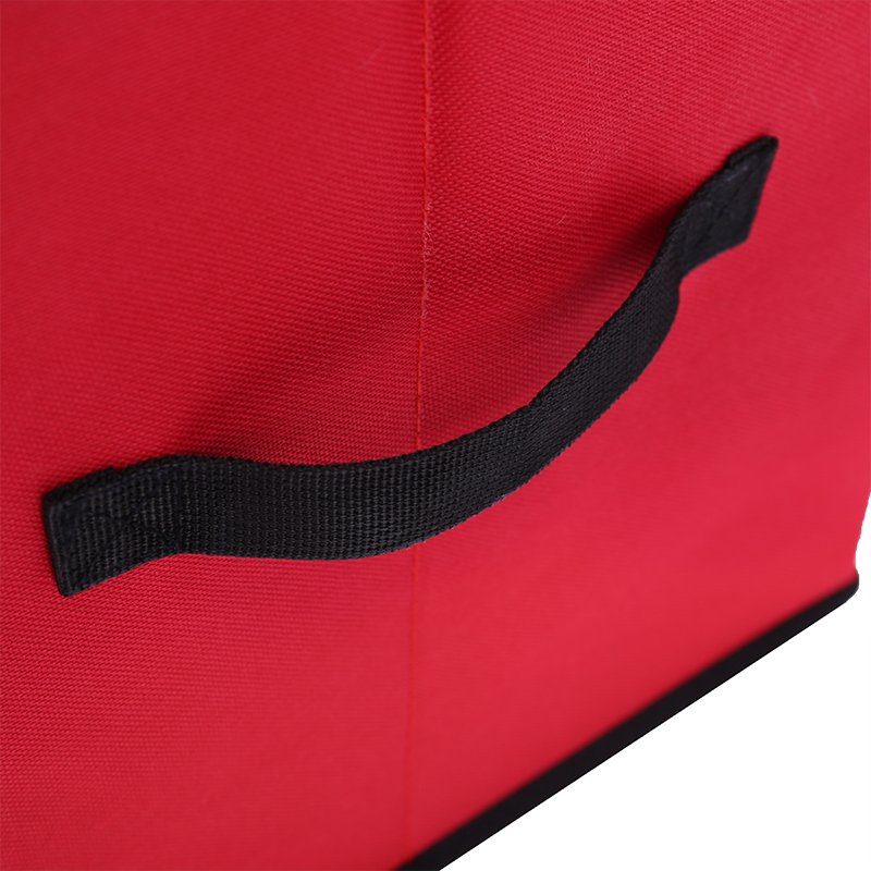 Red Christmas tree storage bag with black handle, close-up side view