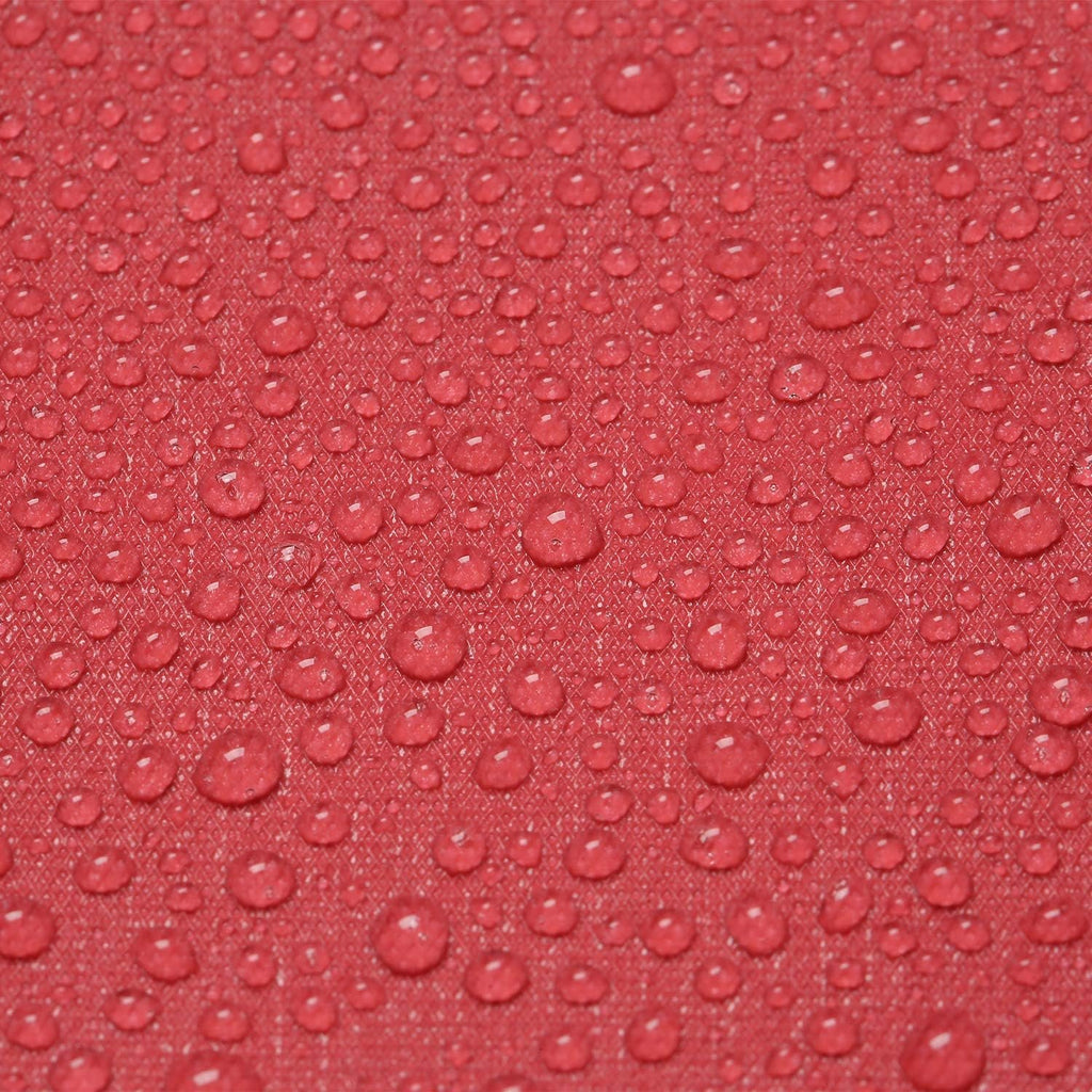 Close-up of red fabric with numerous water droplets, showing texture and water resistance.