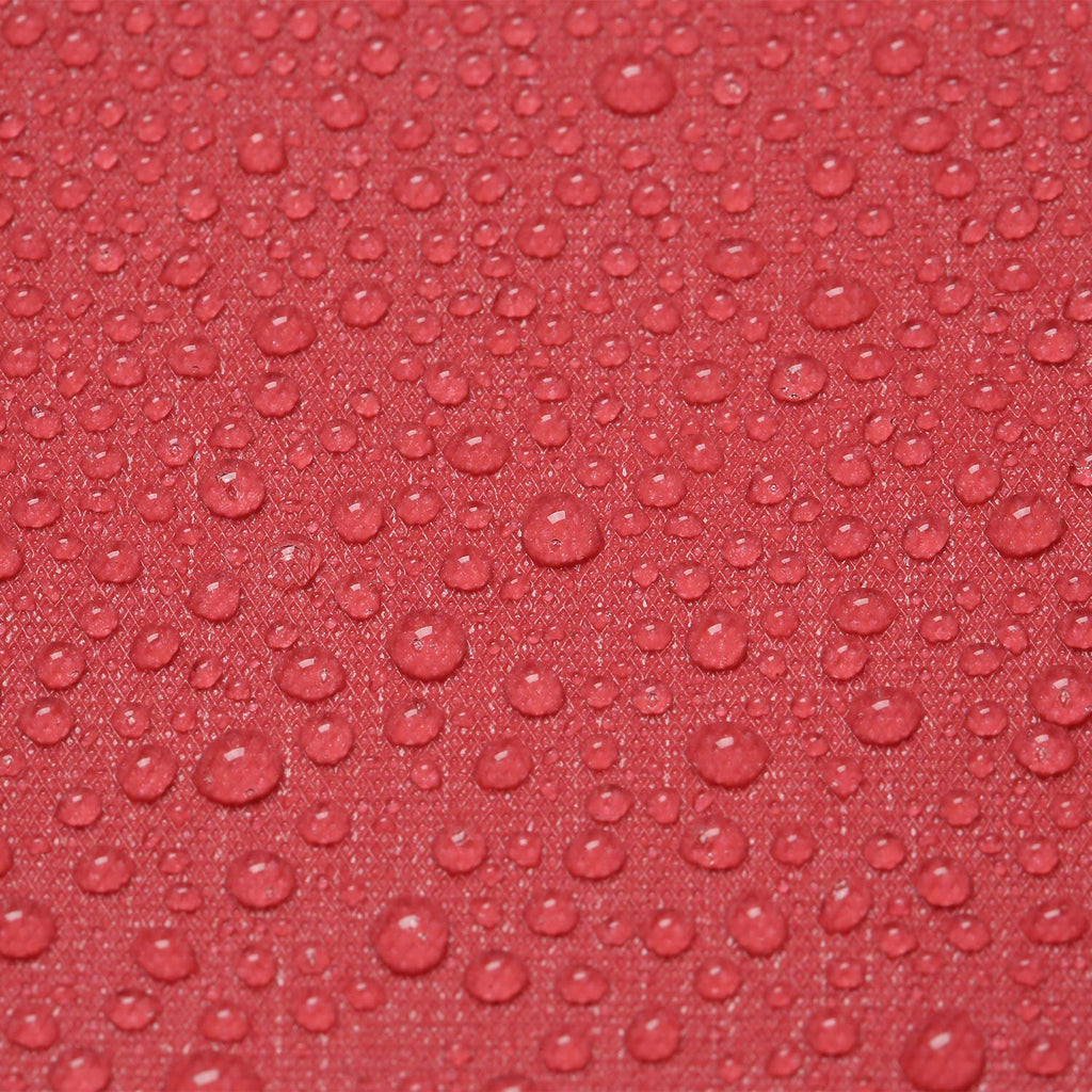 Close-up of red fabric with water droplets showing texture and water-repellent properties