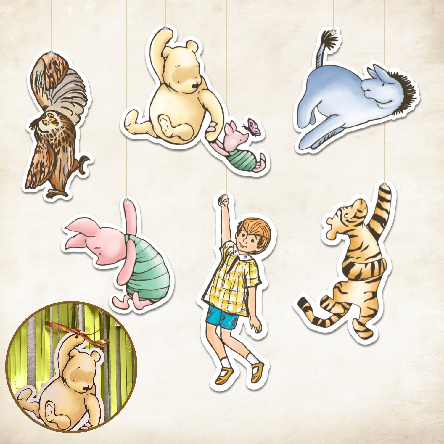 Winnie the Pooh characters including Owl, Pooh, Piglet, Eeyore, Christopher Robin, and Tigger hanging from strings against a textured background.