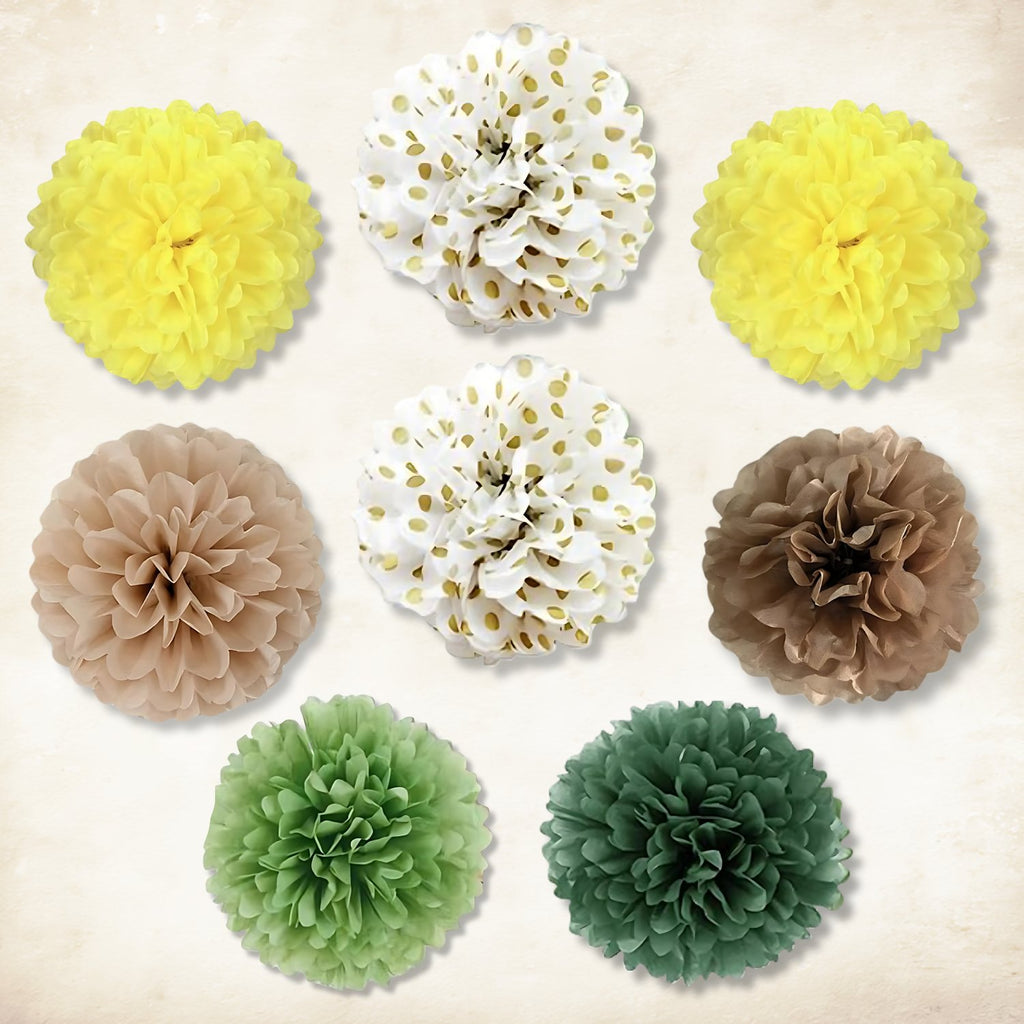 Assortment of nine fluffy tissue paper pom-poms in yellow, white with gold dots, tan, and green hues arranged on a textured background.