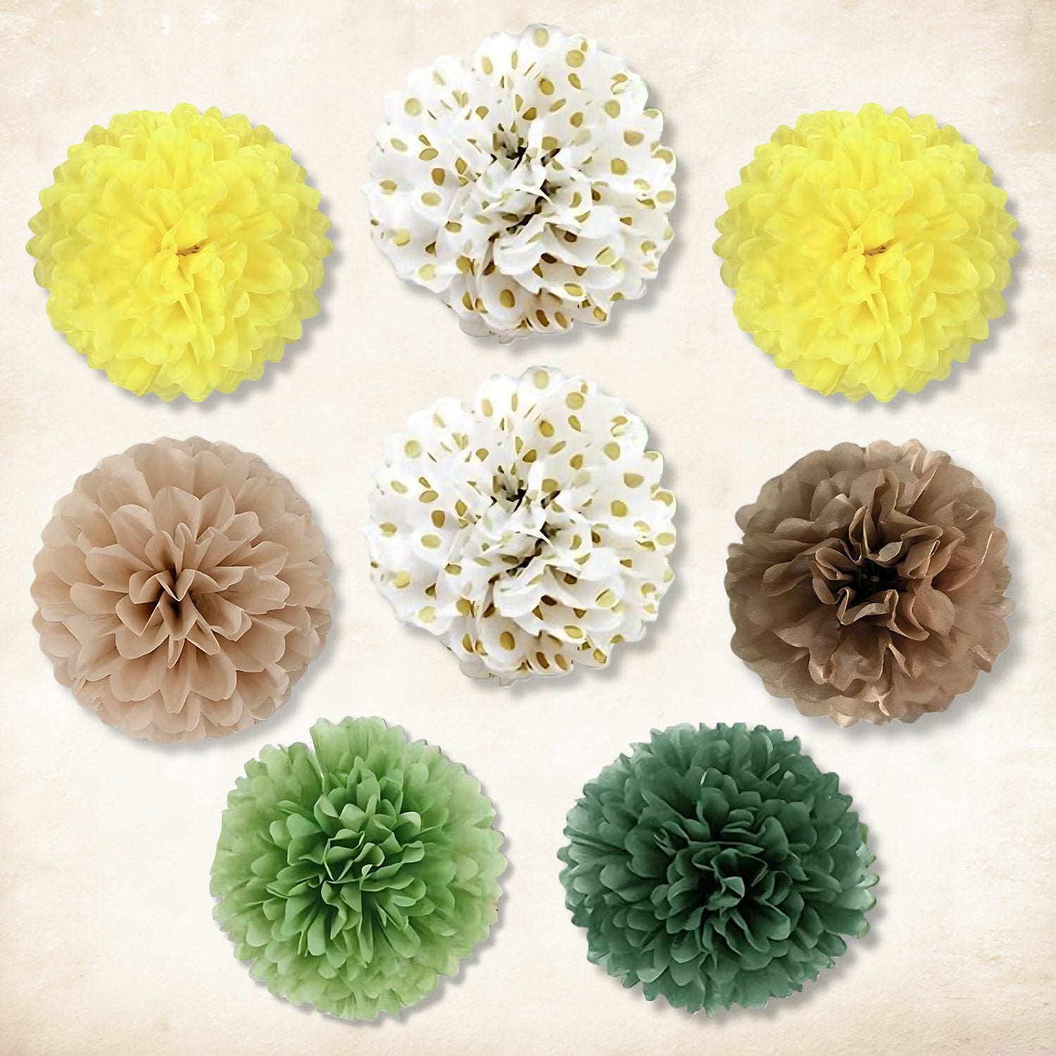 Assortment of nine fluffy tissue paper pom-poms in yellow, white with gold dots, tan, and green hues arranged on a textured background.