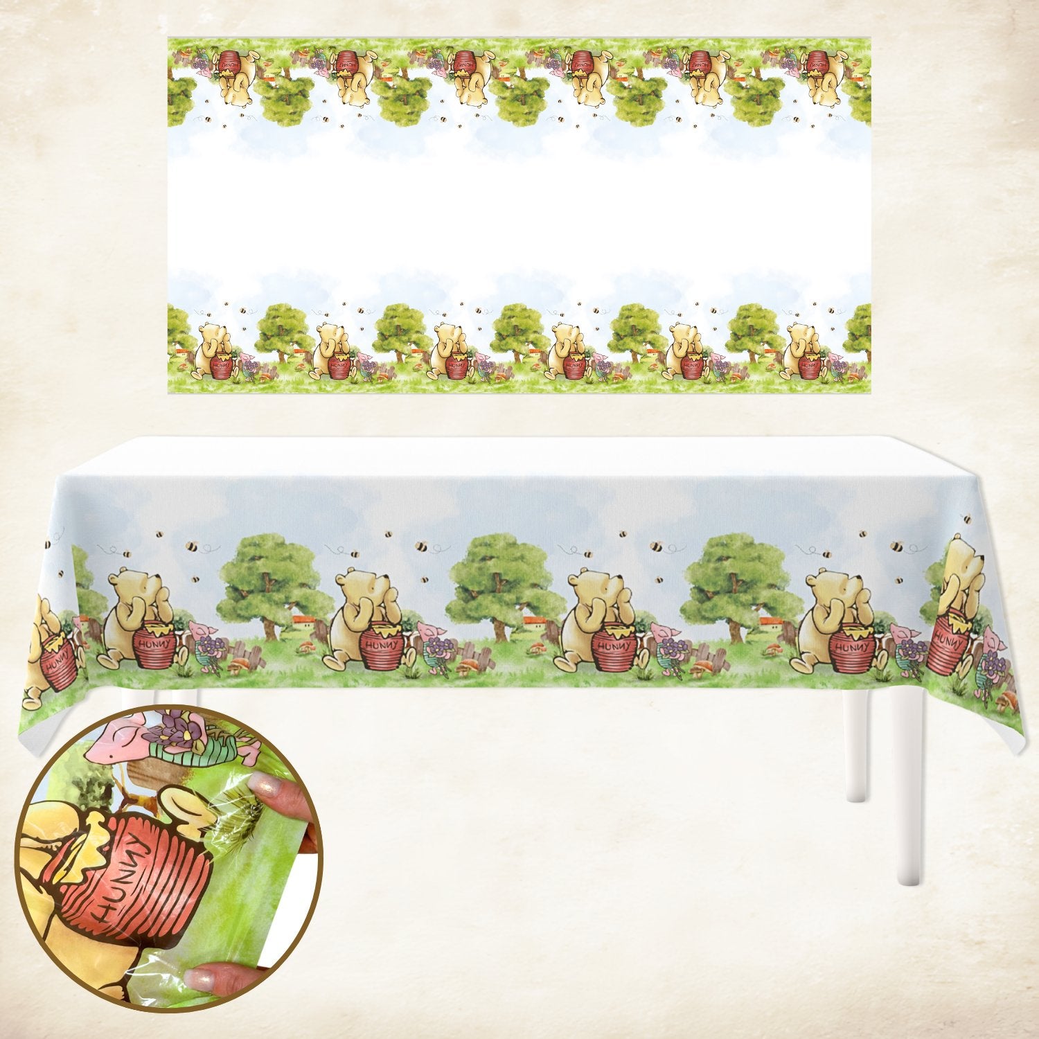 Winnie the Pooh themed tablecloth with a repeating pattern of Pooh and bees, shown on a table with a close-up inset of a hand holding a packaged item.