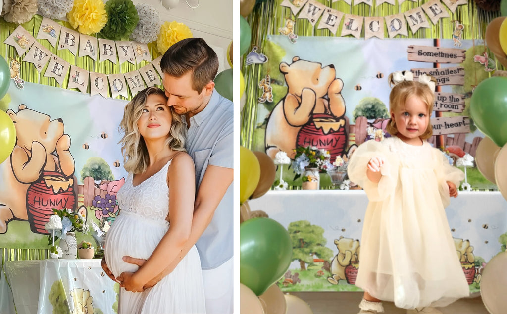 Pregnant couple and toddler posing at a Winnie the Pooh themed baby shower party with balloons and banners.