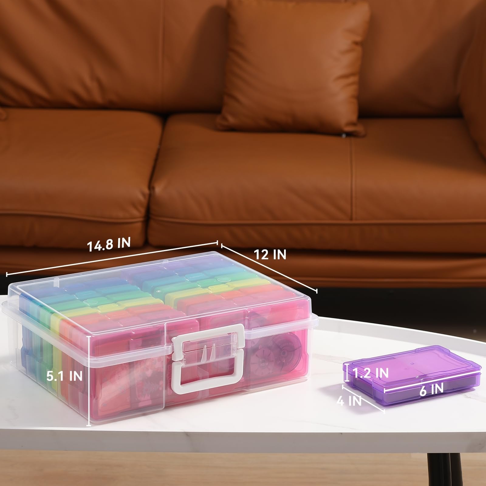 Clear photo storage box with handle and 16 multi-colored cases, shown on a table with dimensions labeled.
