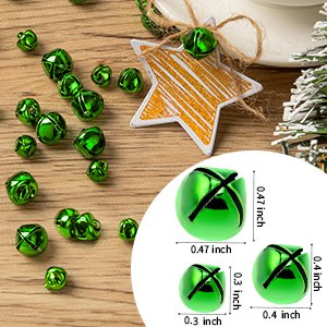Green jingle bells in three sizes with dimensions shown, scattered on a wooden surface with a star ornament.