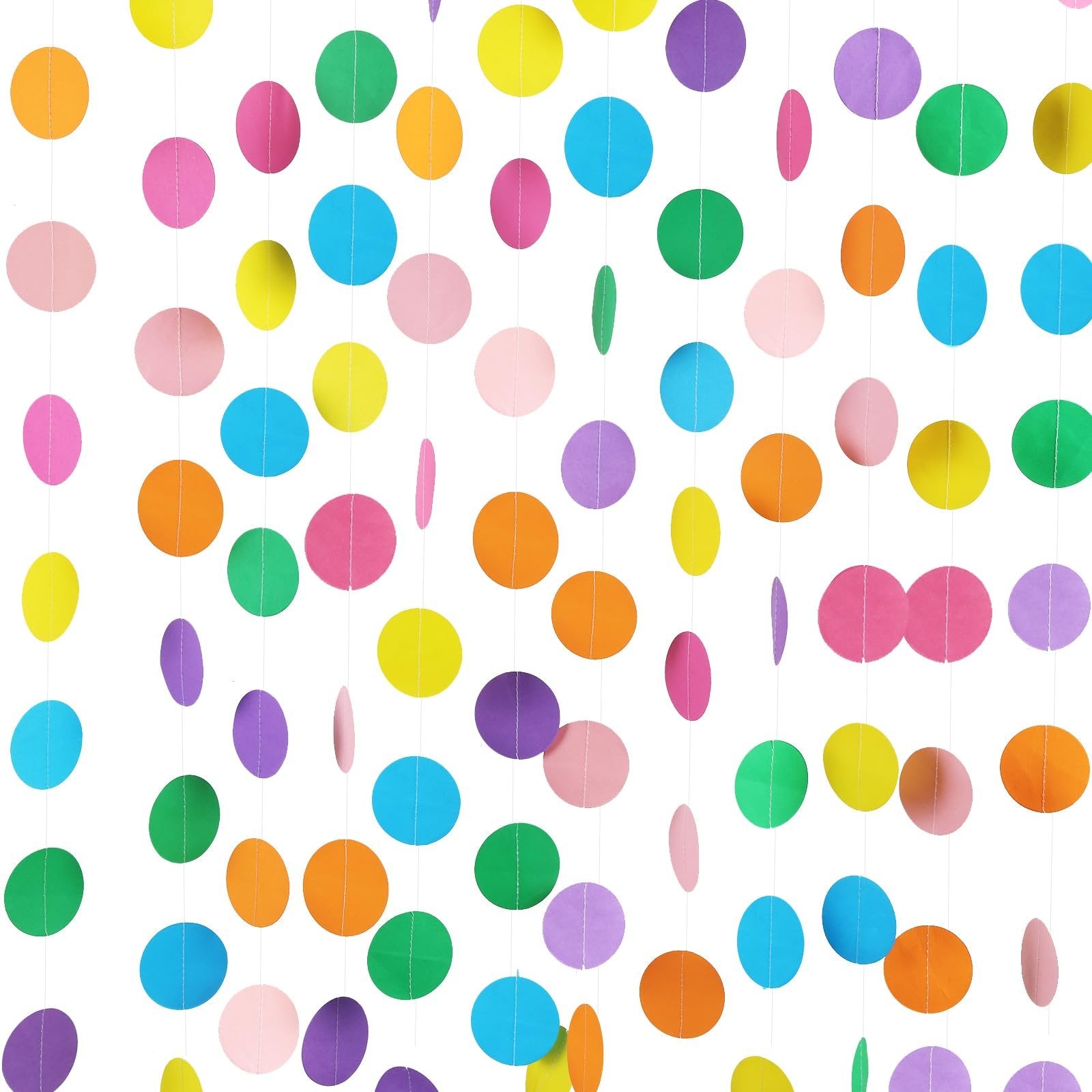 Colorful circle dot paper garlands hanging against a white background, showcasing rainbow colors.