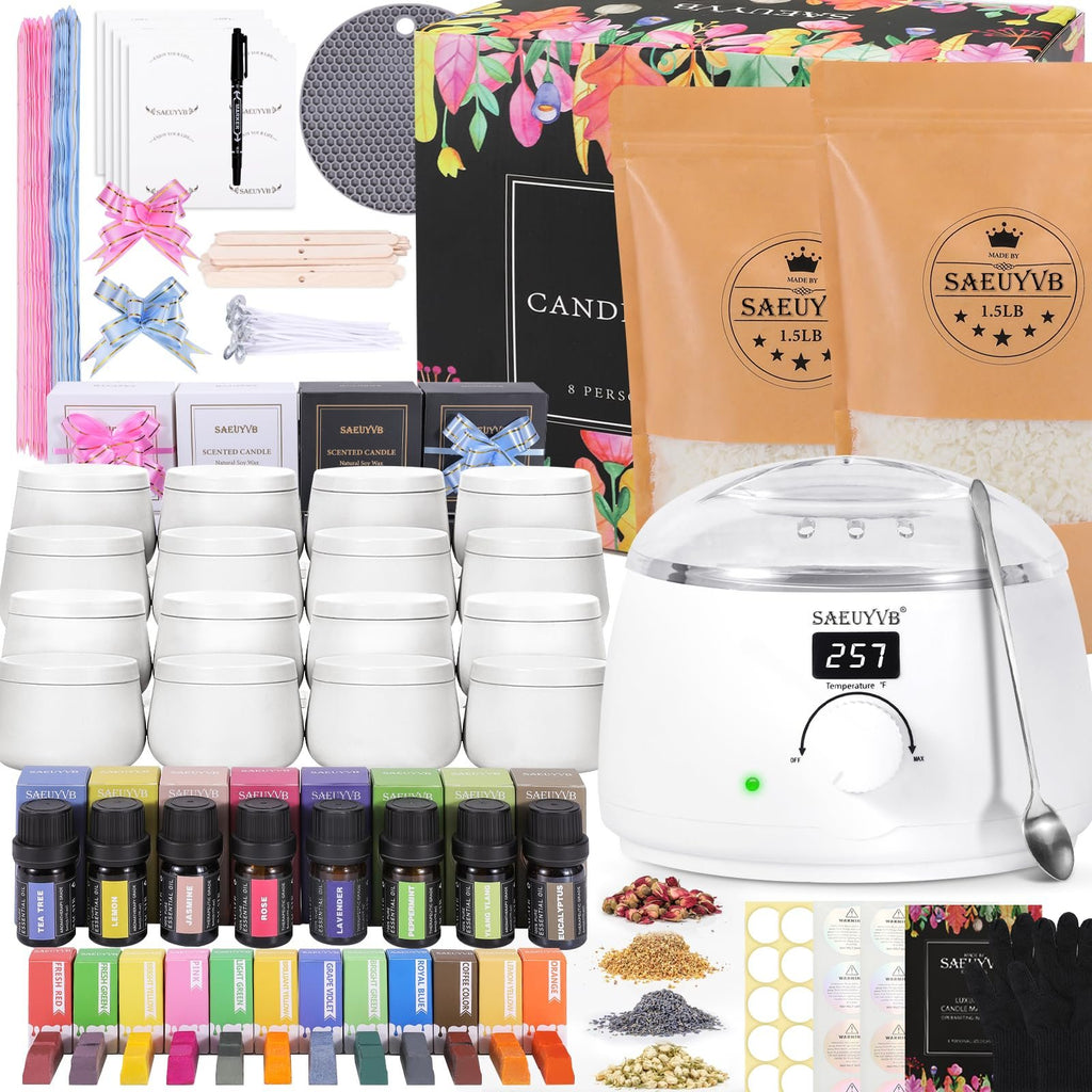Complete candle making kit contents laid out, including wax, tins, essential oils, dyes, wicks, and a wax melter.