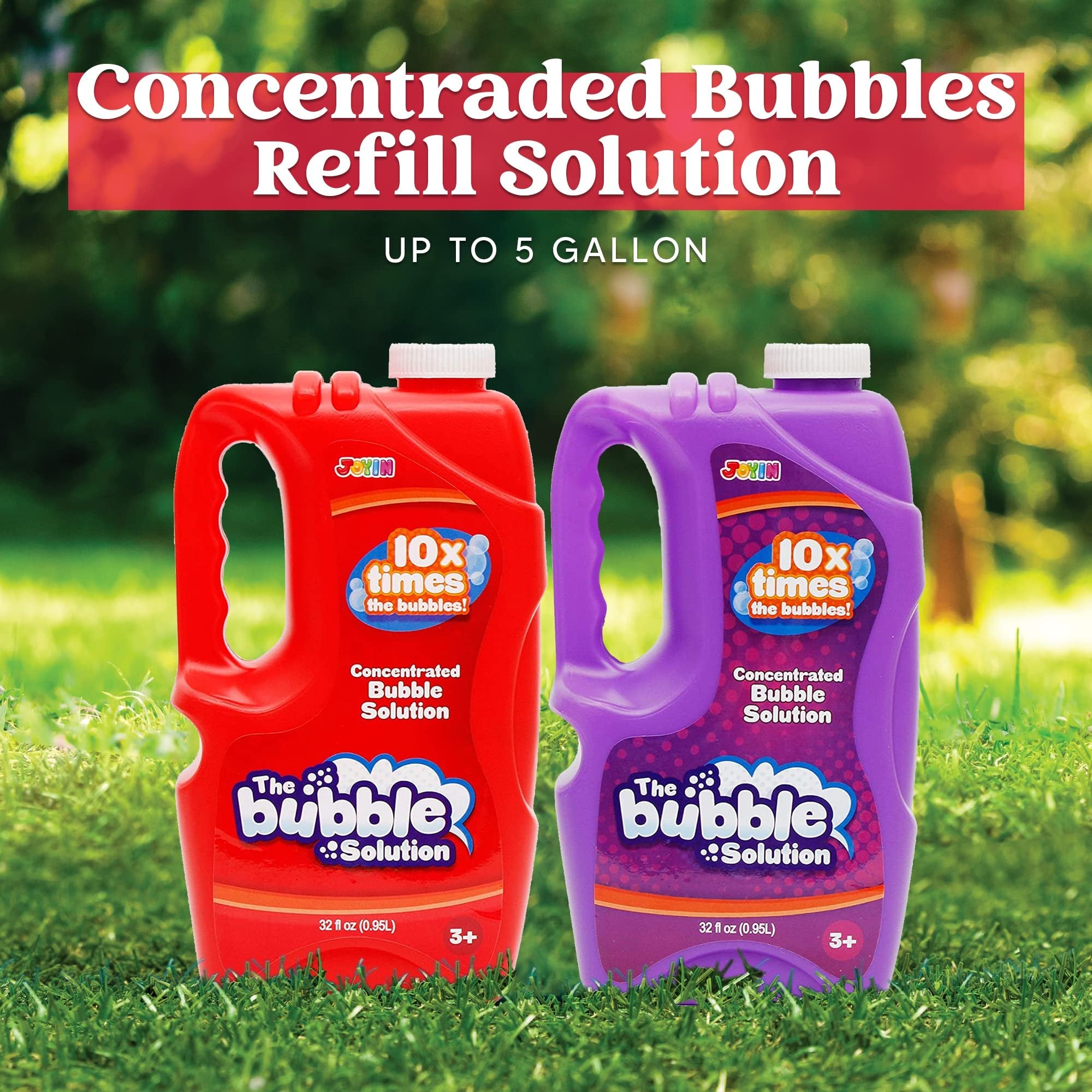 Two bottles of concentrated bubble solution, red and purple, on grass with a green bokeh background.