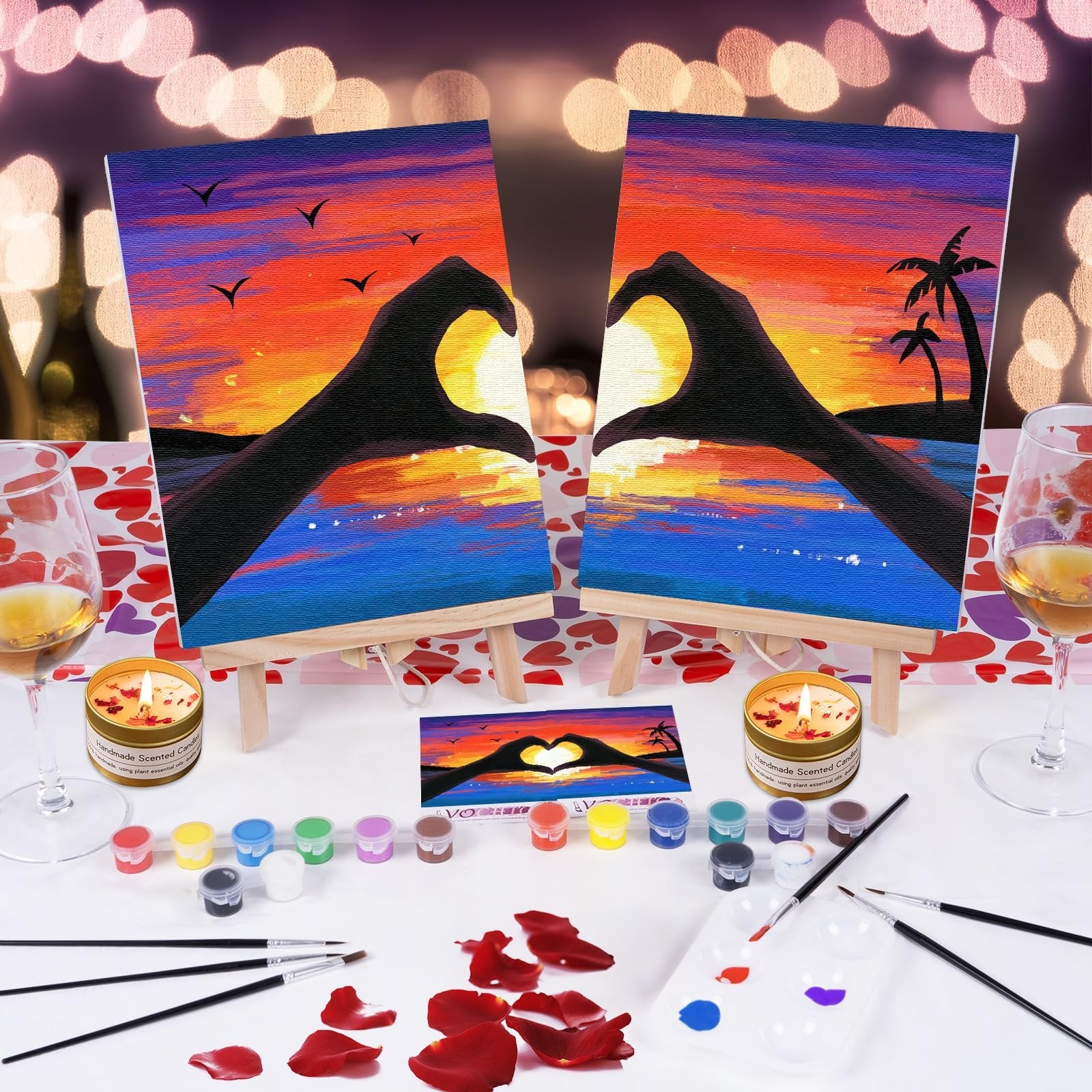 Couples date night painting kit with two 8x10 inch canvases showing a sunset with hands forming a heart, acrylic paints, brushes, and easels.