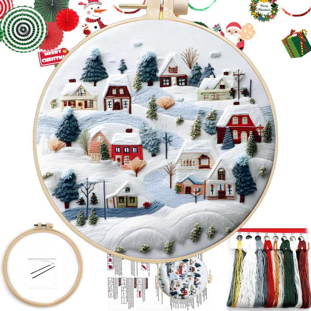 Embroidery kit with a winter village scene on an 8-inch hoop, showing houses and trees covered in snow, with floss and instructions.