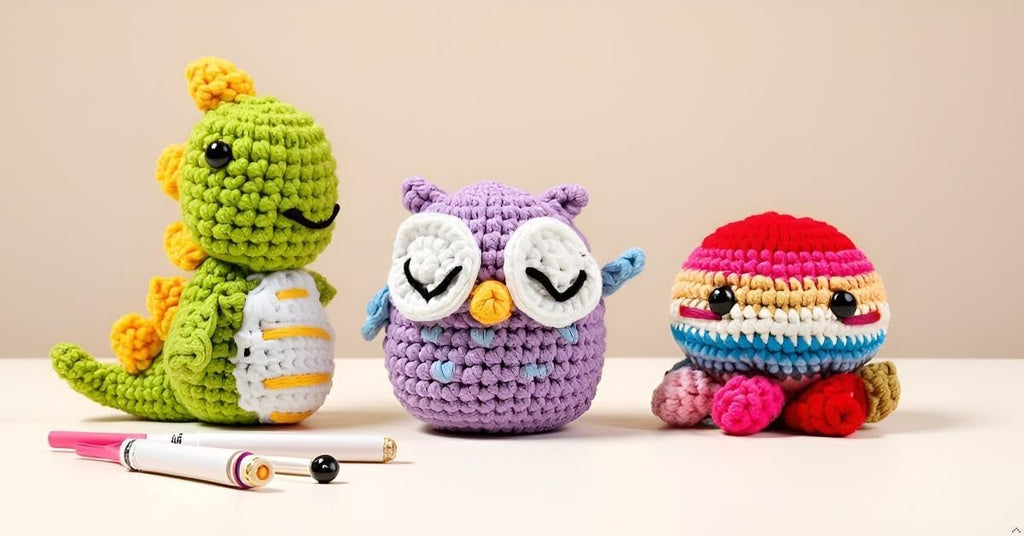 Crocheted dinosaur, owl, and octopus toys with crochet hooks on a light surface.