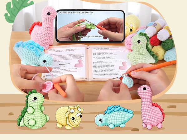 Crochet dinosaur kit with yarn, crochet hooks, instructions, and video tutorial on phone screen.