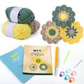 Crochet coaster starter kit with yarn balls, finished coasters, crochet hook, and instruction booklets.