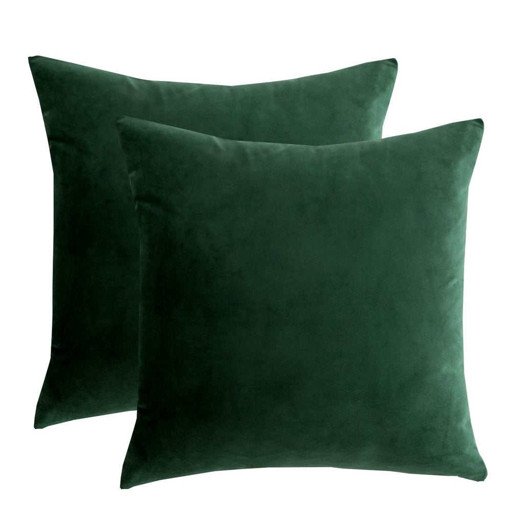 Two dark green velvet throw pillow covers shown from the front on a white background.