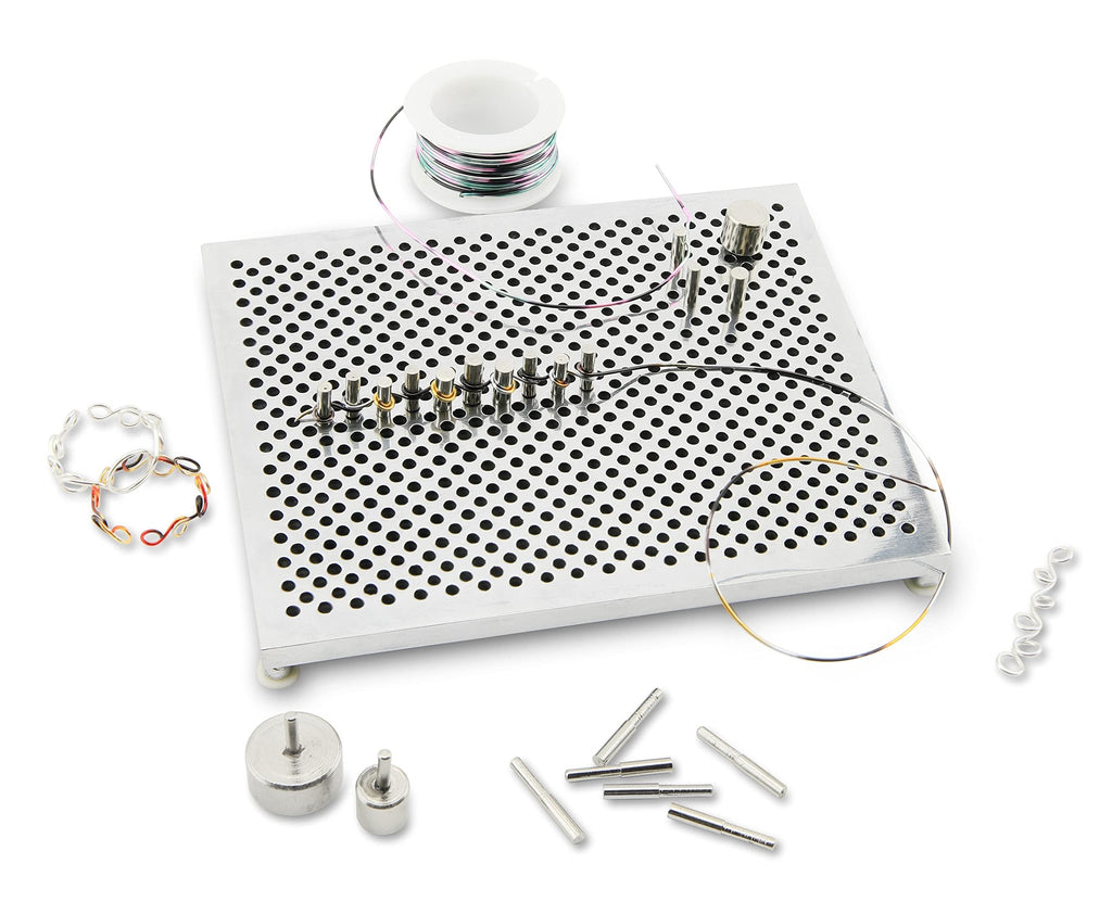 Jewelry making wire jig kit with adjustable pegs, wire spool, and sample wire shapes on a white background.