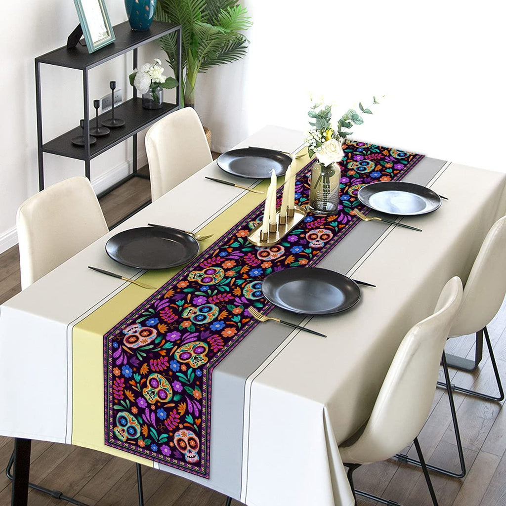 Dia De Los Muertos table runner with sugar skull and floral design on a set dining table