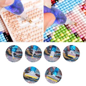 Diamond painting drill pen kit with multiple interchangeable tips shown in use and individually.