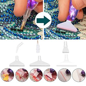 Diamond painting drill pen kit with multiple tips and a placer tool, showing application on a canvas.