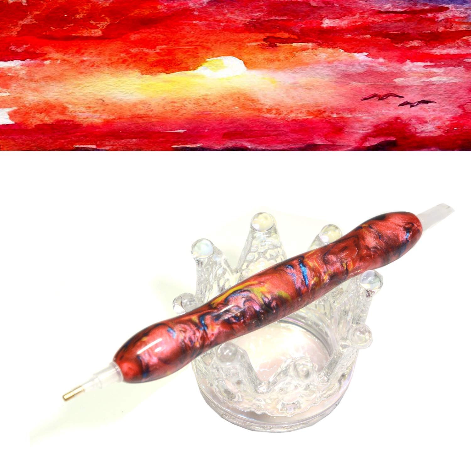 Diamond painting drill pen with red and blue swirls resting on a clear crown-shaped holder, against a watercolor sunset background.