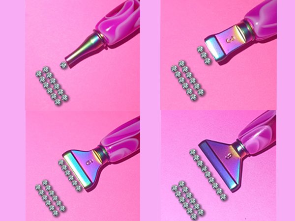 Diamond painting pen kit with multiple tips and diamond beads on pink background