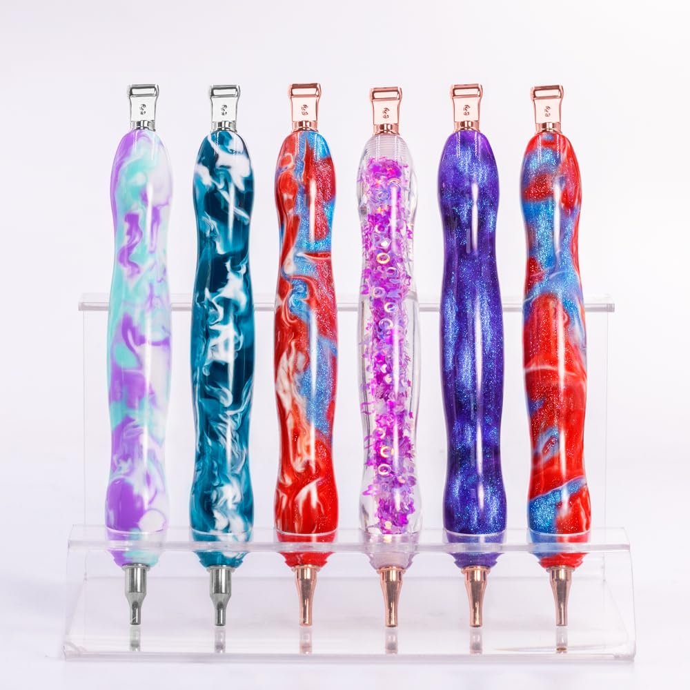 Six diamond painting pens with swirling purple, teal, red, and blue patterns displayed on a clear stand.