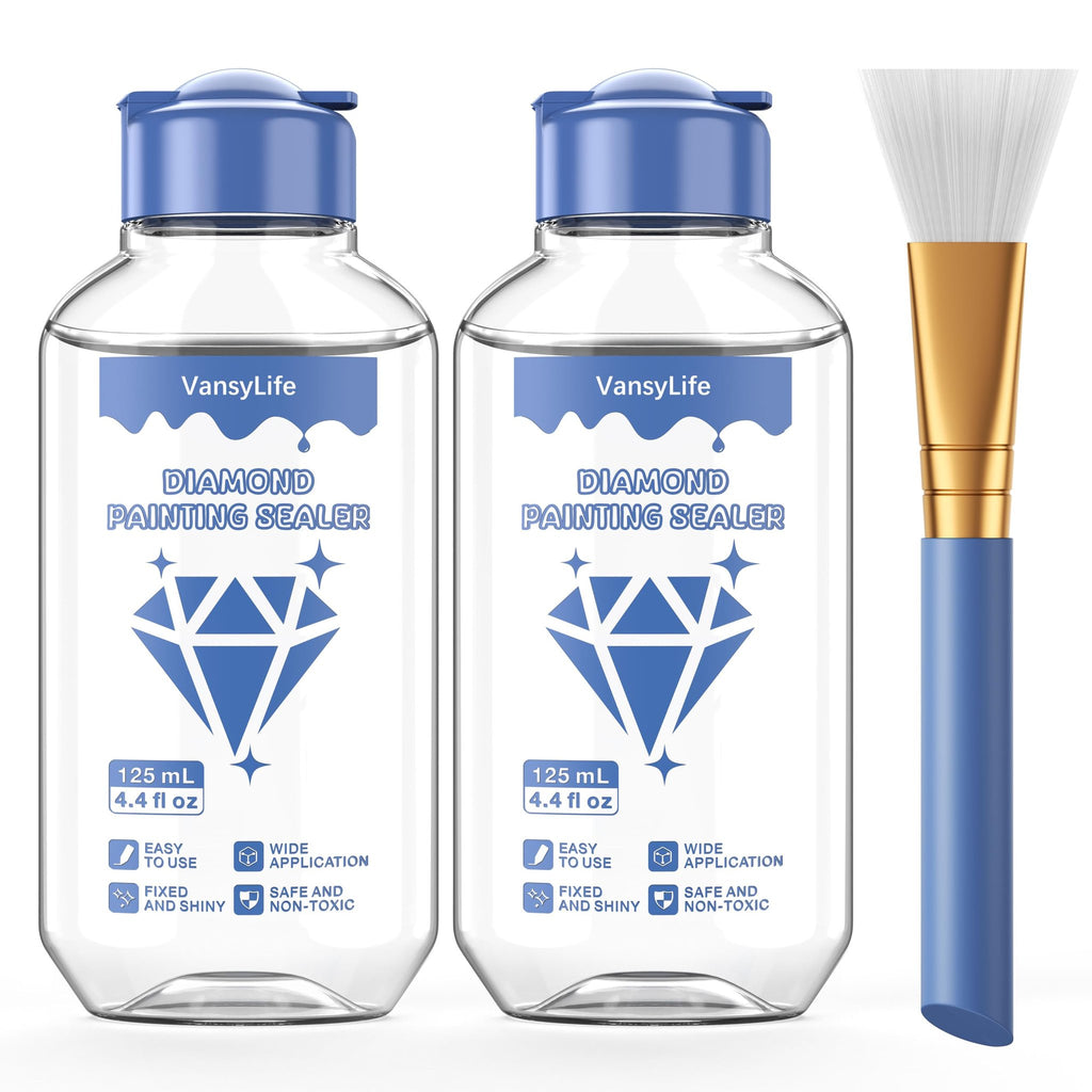 Two bottles of diamond painting sealer and one brush on a white background. The bottles have blue caps and labels with diamond graphics.