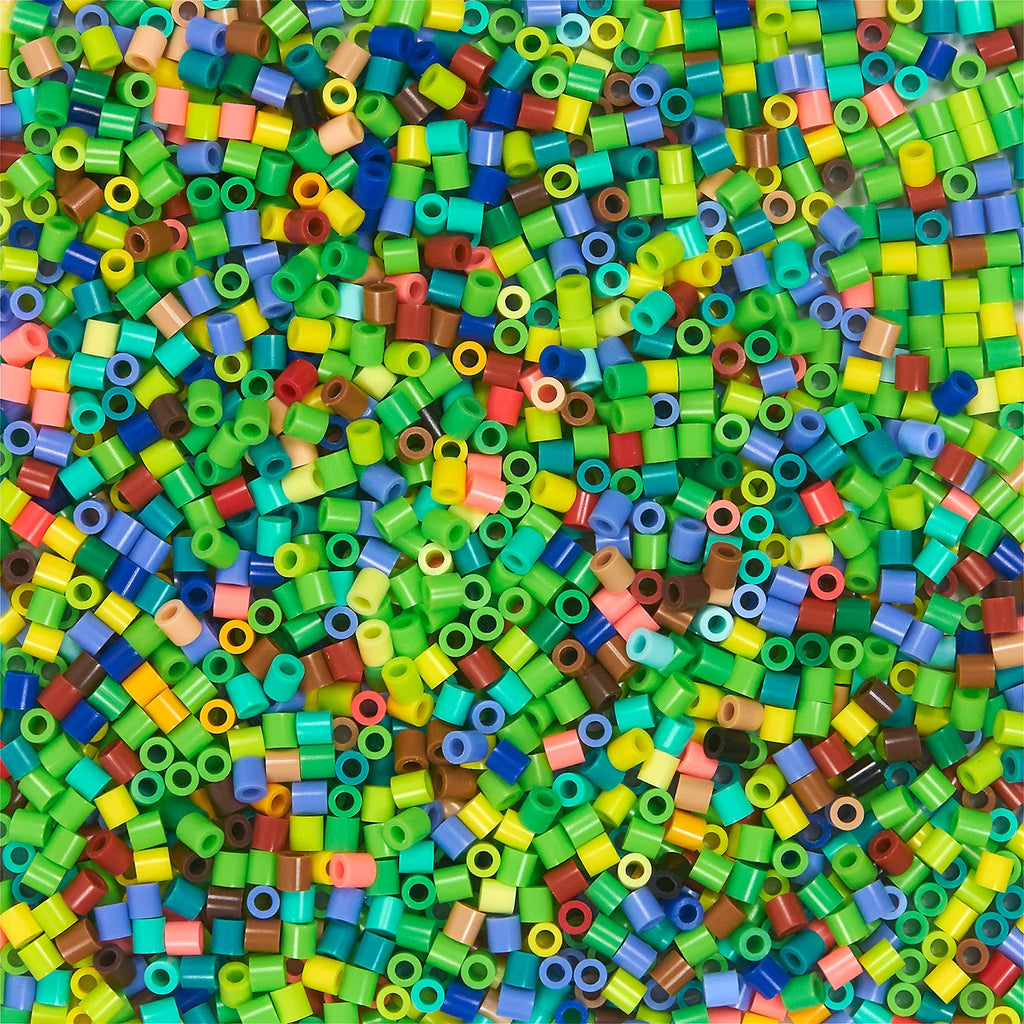 Pile of colorful fuse beads in various shades of green, blue, red, yellow, and brown.
