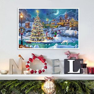 Diamond painting kit showing a snowy Christmas village scene with a decorated tree and moon in the night sky.