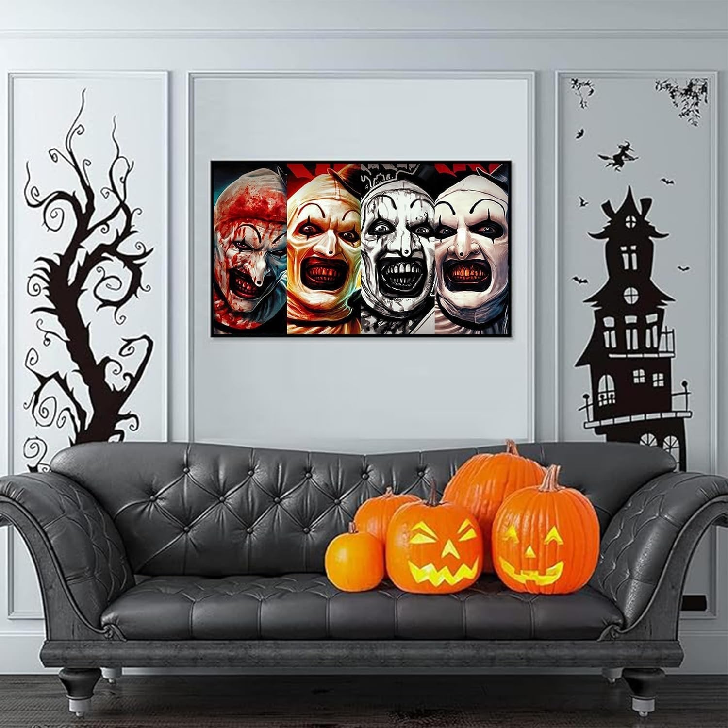 Four creepy clown faces displayed on a wall above a black leather couch with pumpkins, set in a Halloween-themed room.