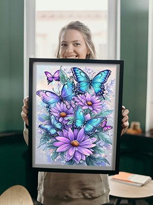 Woman holding framed diamond art kit featuring blue and purple butterflies and flowers
