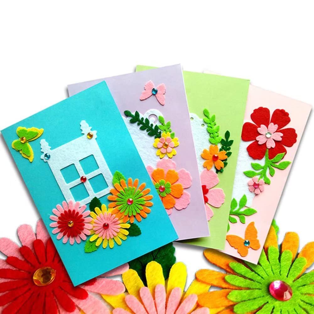 DIY card making kit with colorful felt flowers, butterflies, and house shapes on blank cards and envelopes.
