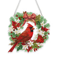 Diamond art cardinal bird hanging ornament with poinsettias and holly on a white background