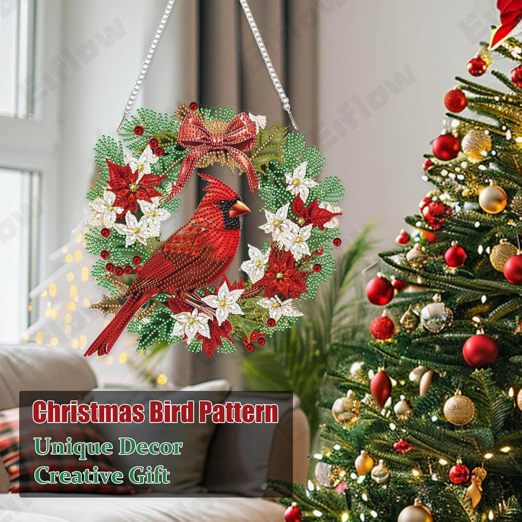 Diamond art cardinal bird wreath ornament hanging near a decorated Christmas tree