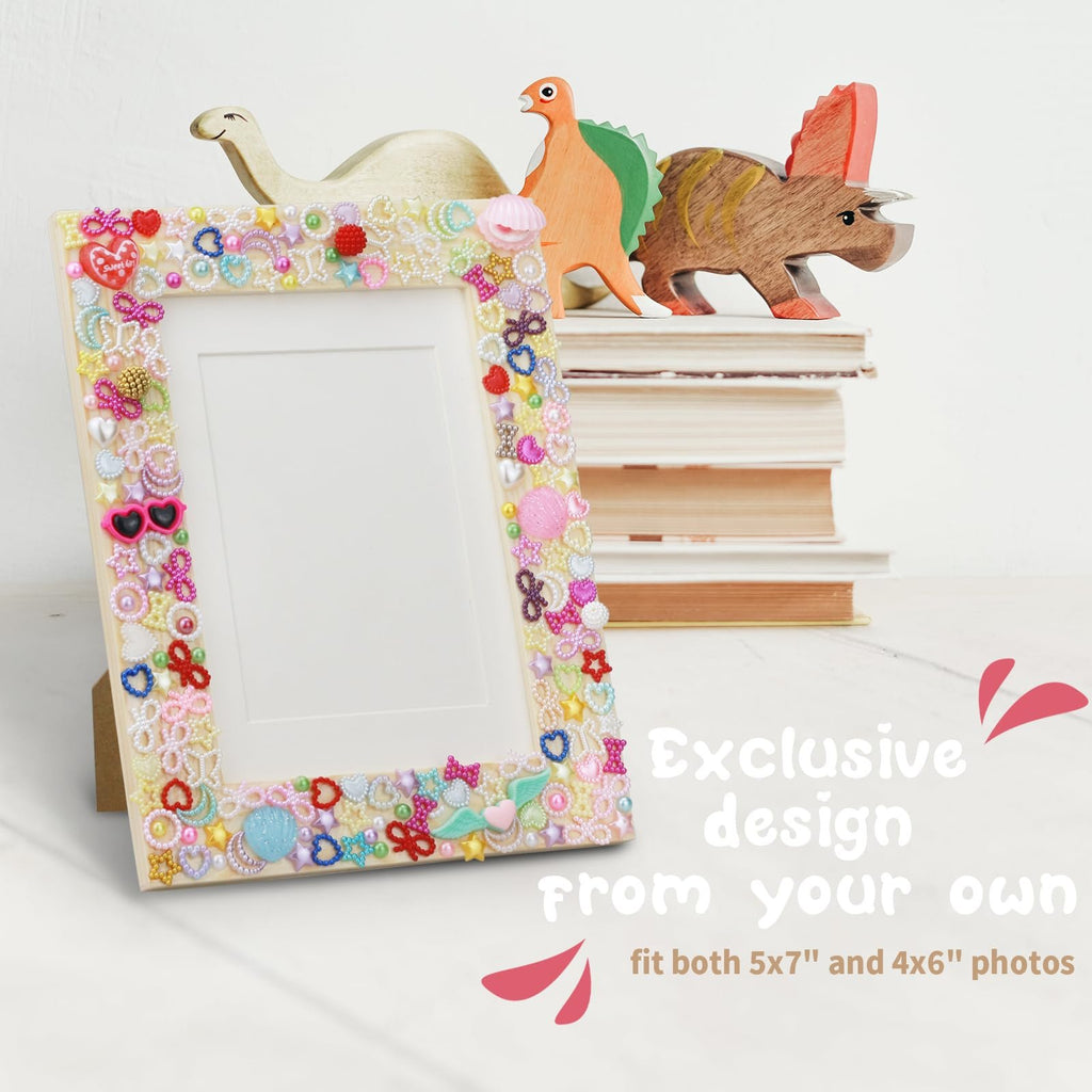 DIY mosaic picture frame decorated with colorful beads and charms, shown with wooden dinosaur toys and books.