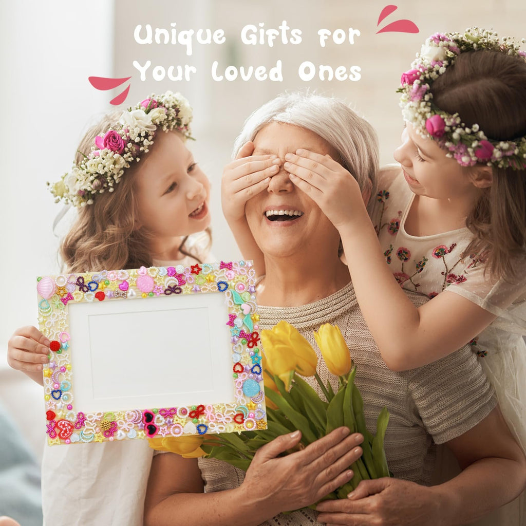 Grandmother surprised by two young girls holding a decorated mosaic picture frame and yellow tulips
