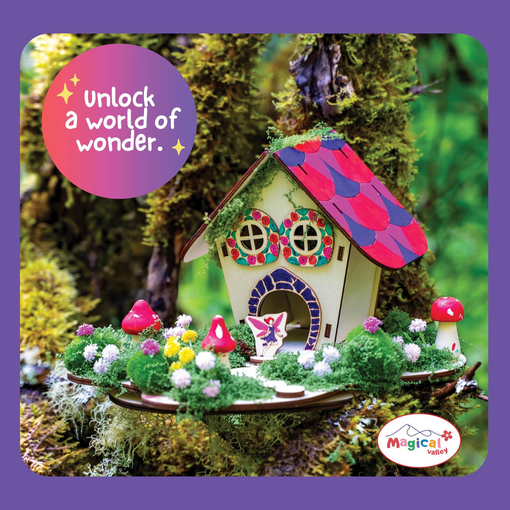 DIY wooden fairy house craft kit assembled and decorated with moss, flowers, and mushrooms on a mossy branch.