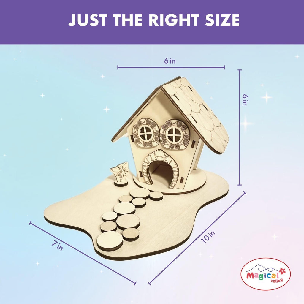 Wooden fairy house craft kit on base with stepping stones, showing dimensions 6x6 inches and 7x10 inches.