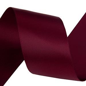 Maroon double-face satin ribbon spool, close-up studio shot on white background.
