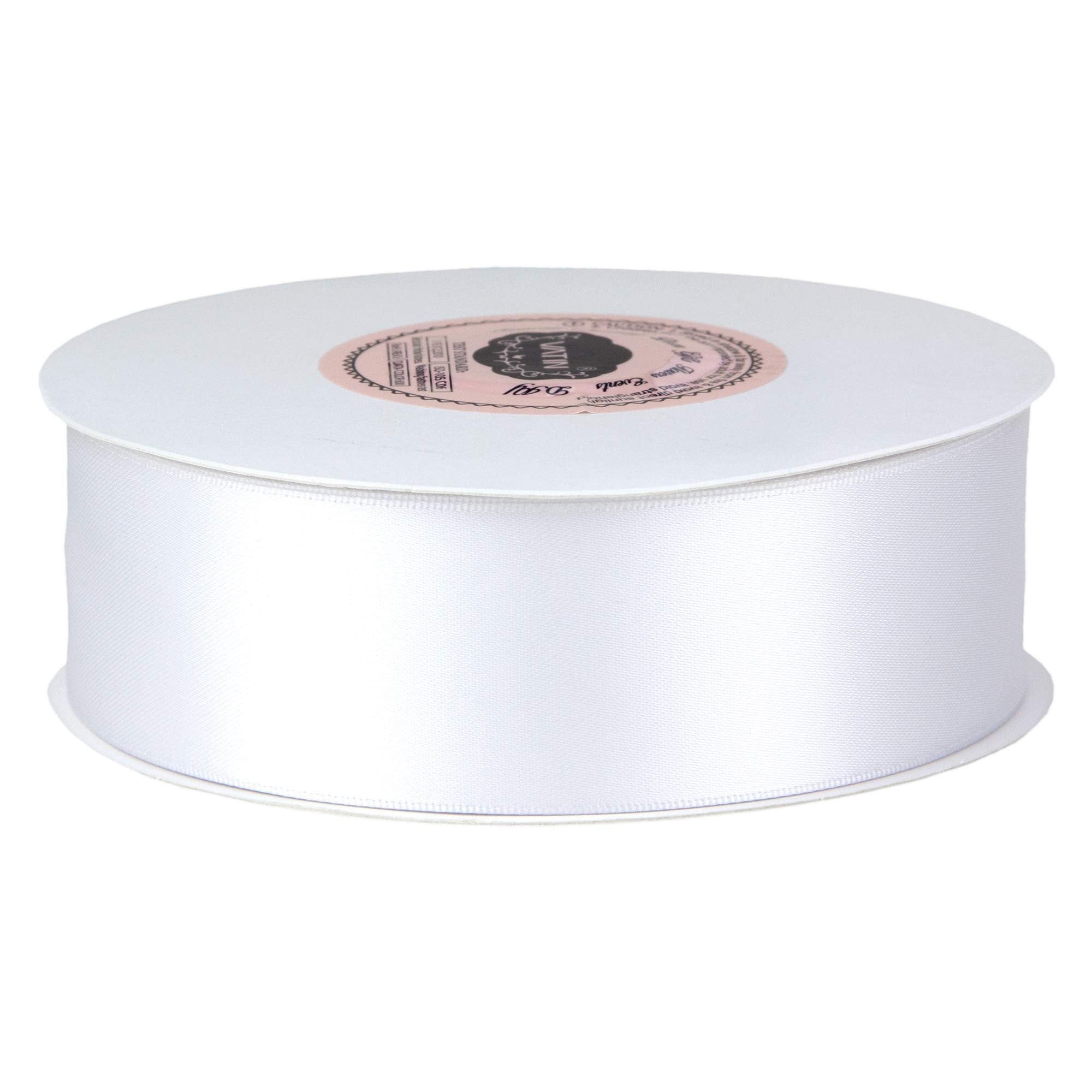 Spool of white double-face satin ribbon on a white background, angled view.