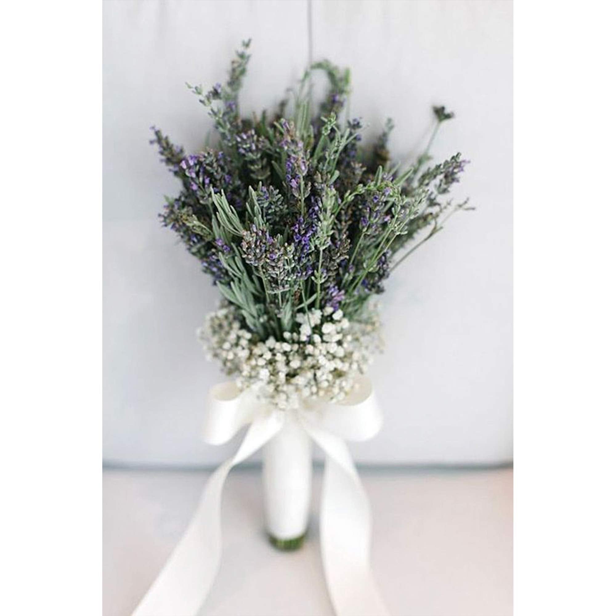 Lavender and baby's breath bouquet tied with a white satin ribbon bow