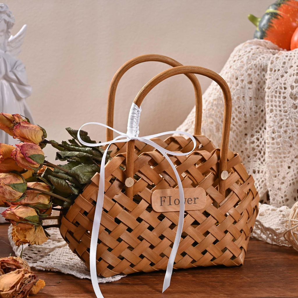 Woven basket with dried roses and white ribbon, featuring a small wooden tag that says 'Flower'