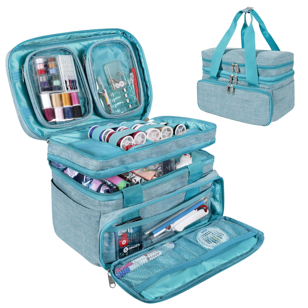 Open teal sewing storage bag showing compartments filled with spools of thread, needles, scissors, and fabric.