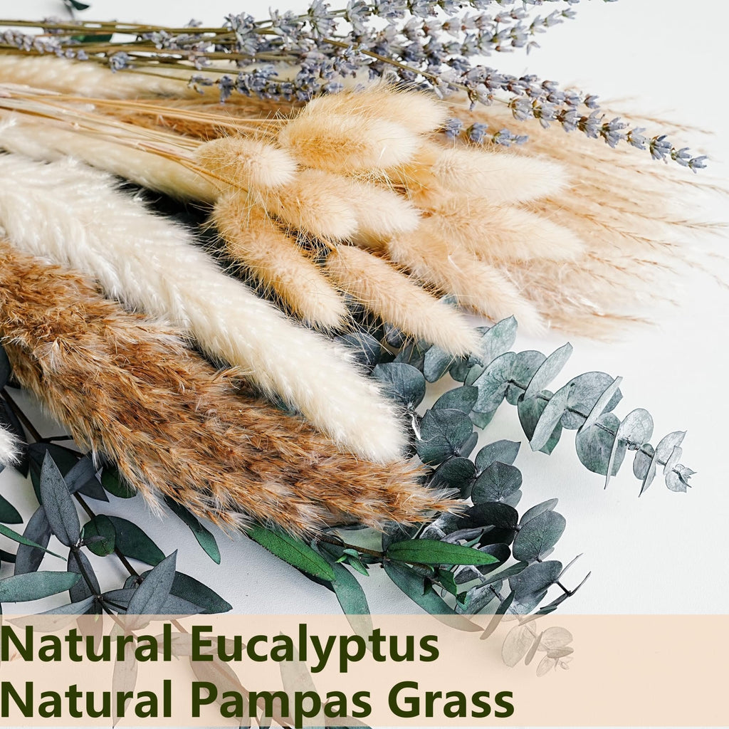 Dried boho flower bouquet with pampas grass, lavender, eucalyptus, and rabbit tail on a white background.